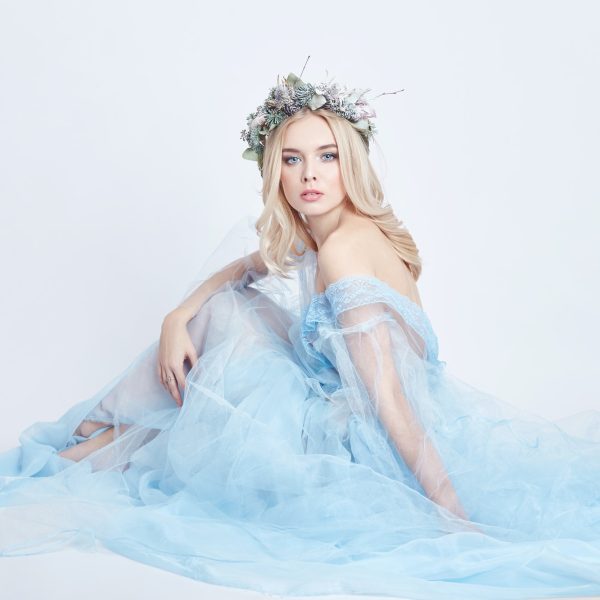 charming-fairy-woman-in-a-blue-ethereal-dress-and-a-wreath-on-her-head-on-white-background-gentle.jpg
